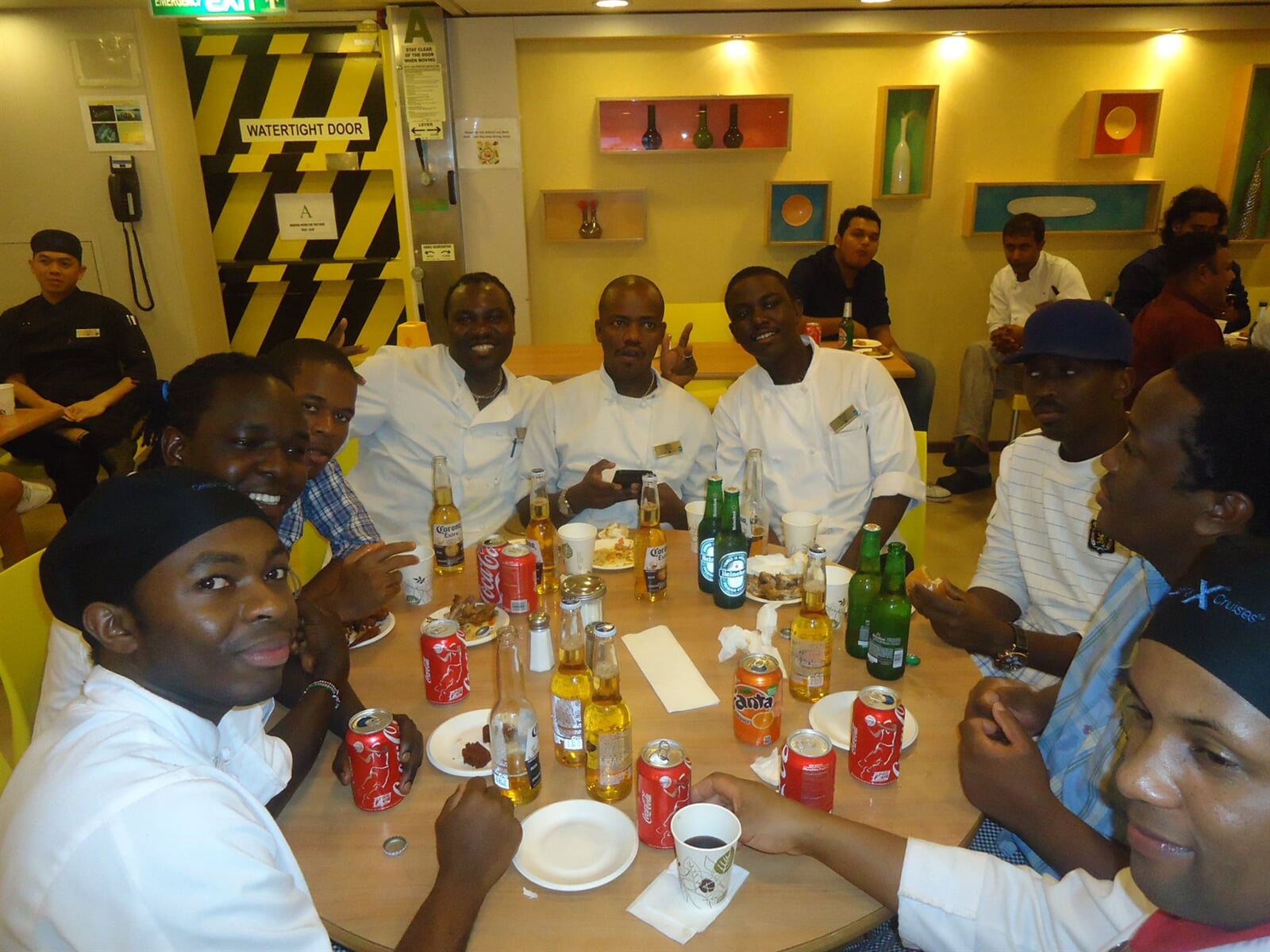 Hospitality staff seated around a dining table