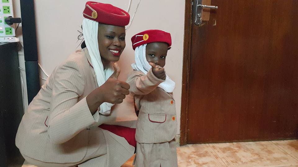 Two airline crew members in uniform