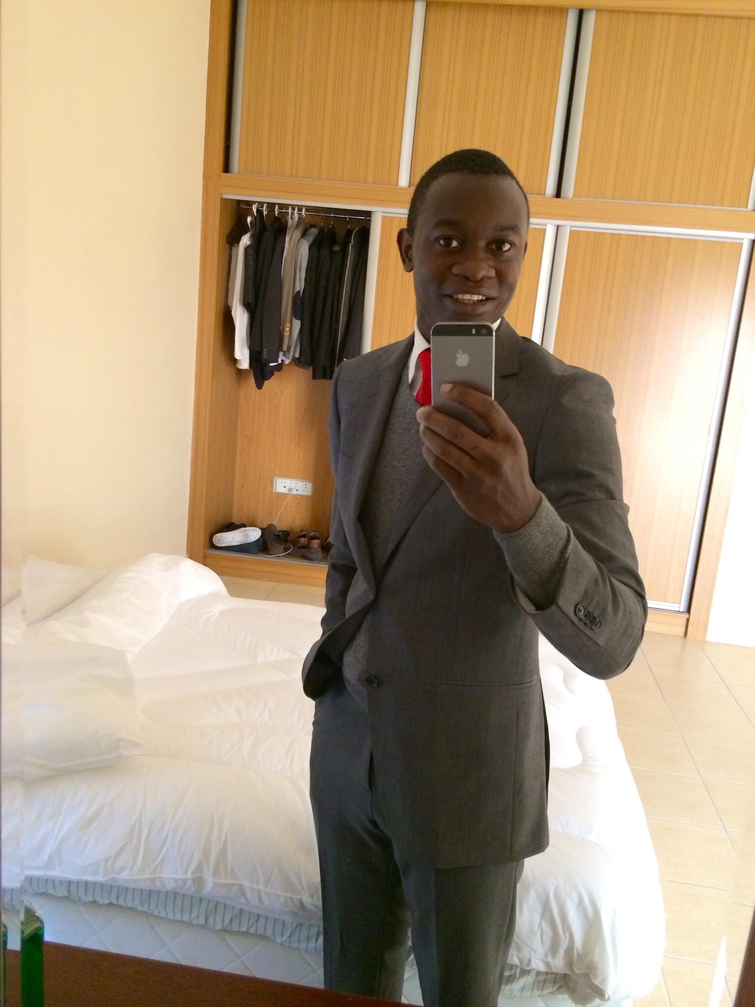 Person posing in formal clothing indoors